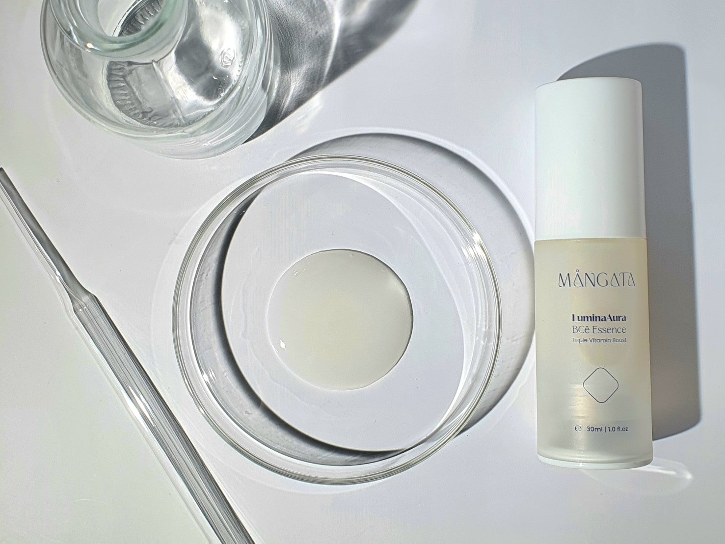 Milky skin brightening vitamin essence in petri dish.