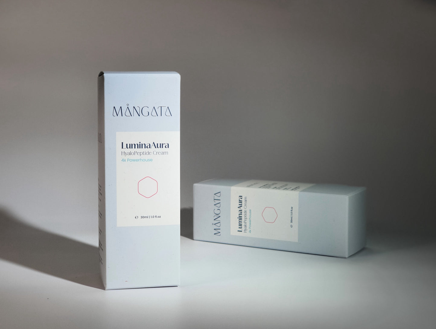 Two elegant closed skincare box with a minimalist design and brand logo on the front.
