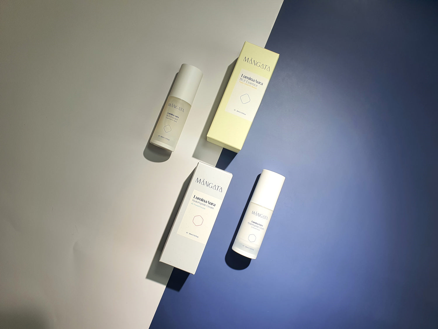 Two skincare bottles and boxes arranged side by side on a white and dark blue background. The bottles are sleek and modern, with minimalist designs, while the boxes feature the brand logo prominently.