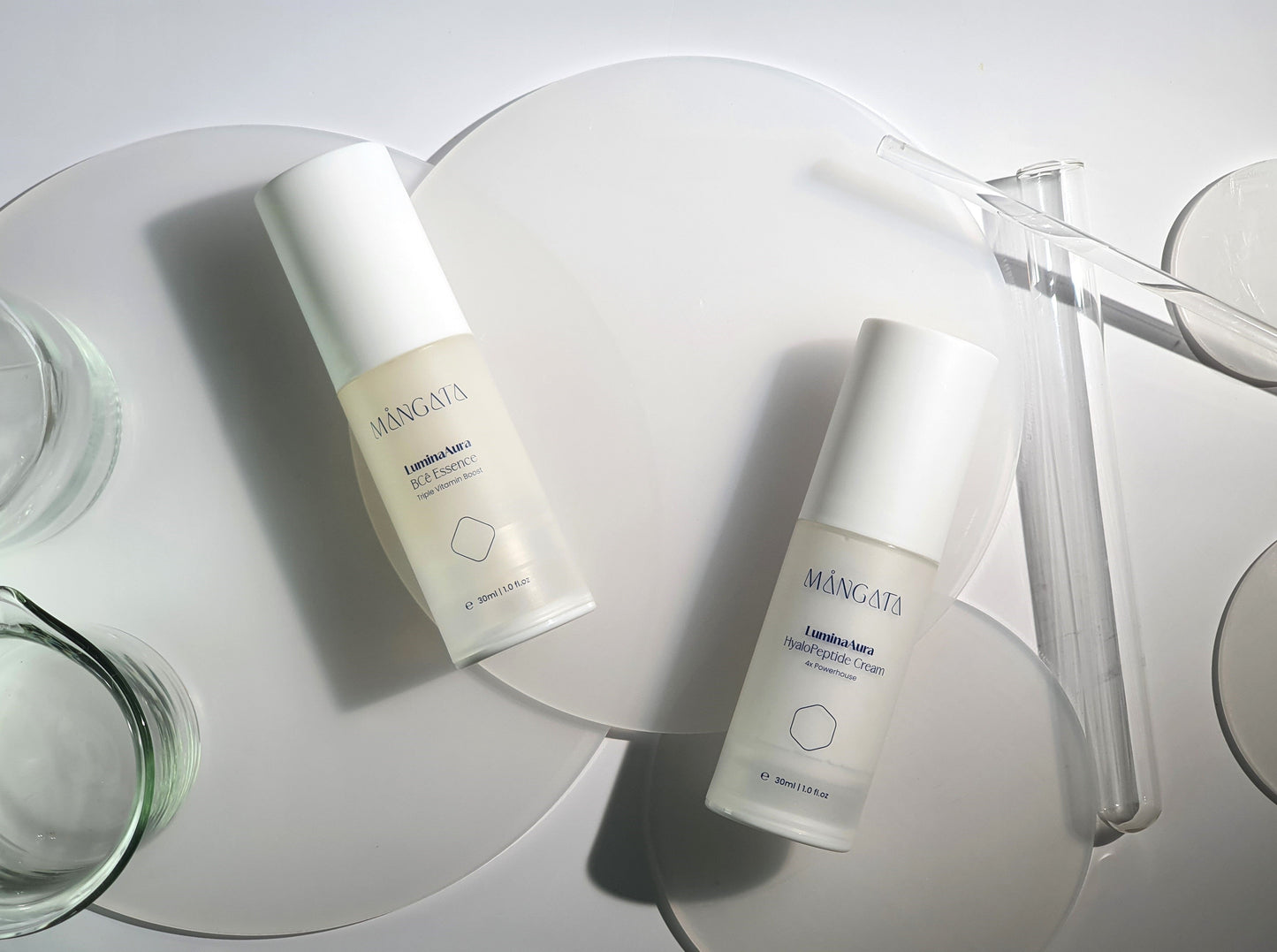 Elegant bottle of vitamin hydrating essence and brightening cream lying on matte round shape plate with  lab equipment surrounding.