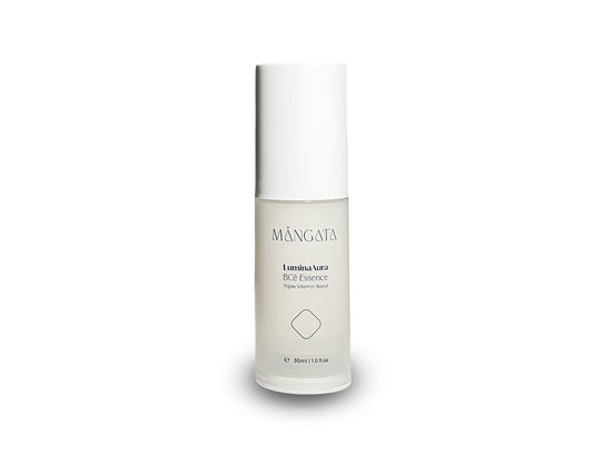 Elegant bottle of vitamins hydrating essence with a white cap.